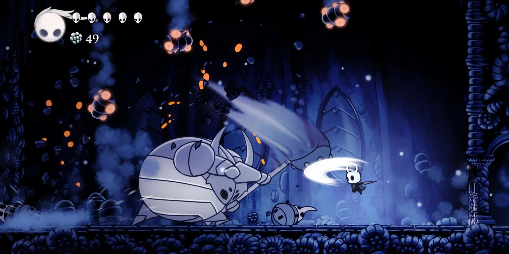 Chiến đấu với quái vật bọ khổng lồ trong Hollow Knight, một cảnh điển hình của gameplay Metroidvania