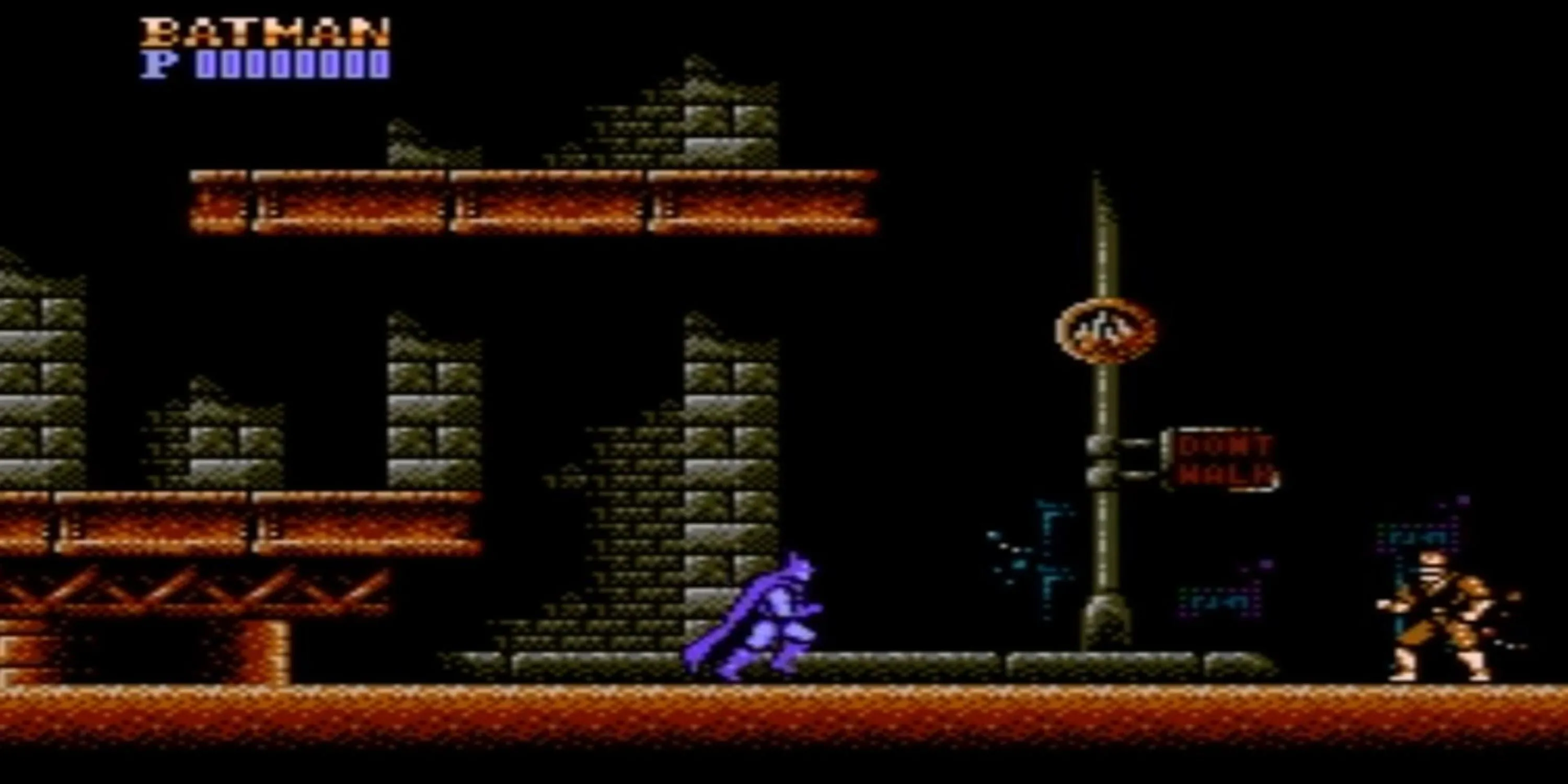 Batman đối mặt kẻ thù trên đường phố Gotham trong Batman: The Video Game (NES), thể hiện lối chơi platforming cổ điển đầy thử thách.